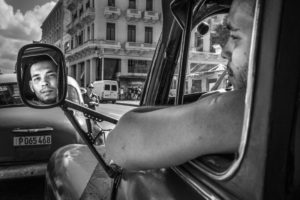 Cuba, Havanna, Man looks in the side mirror of his car, face, reflection, Cuba, Havanna, Man looks in the side mirror of his car, face, reflection,